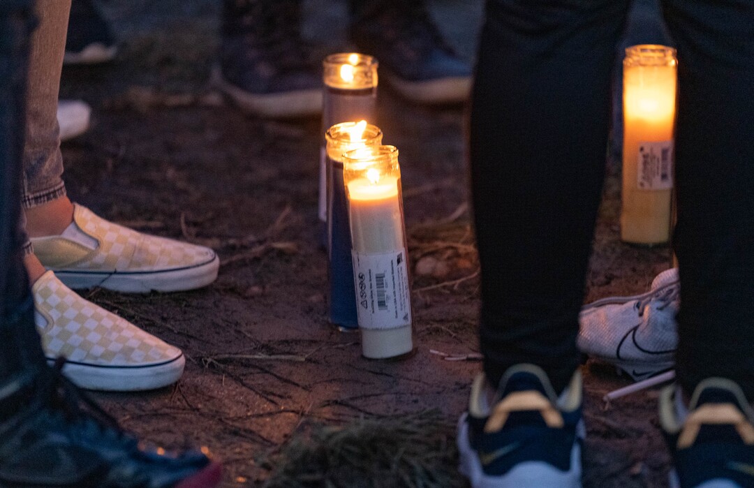 (Francisco Kjolseth | The Salt Lake Tribune) More that a hundred people gather at the candlelight vigil of Hunter High football players Paul Tahi , 15, Tivani Lopati, 14, and Ephraim Asiata, 15, on Friday, Jan 14, 2022, in West Valley City, near Hunter High School along 1400 South at Mountain View Corridor. Paul Tahi and Tivani Lopati were killed in a shooting, while Ephraim Asiata remains in critical condition.