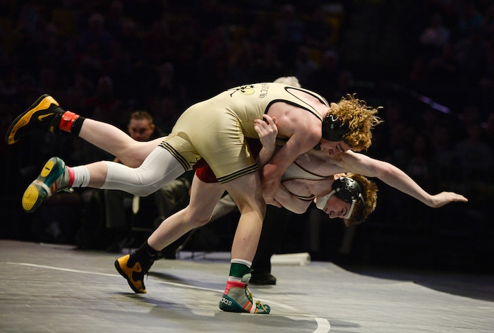 (Francisco Kjolseth  |  The Salt Lake Tribune)  Stockton O'Brien of Wasatch sends Jeremy Evans of Viewmont out of the ring in the Class 5A 132 weight class state wrestling championship match at the Utah Valley University UCCU Center on Thursday, Feb. 8, 2018.