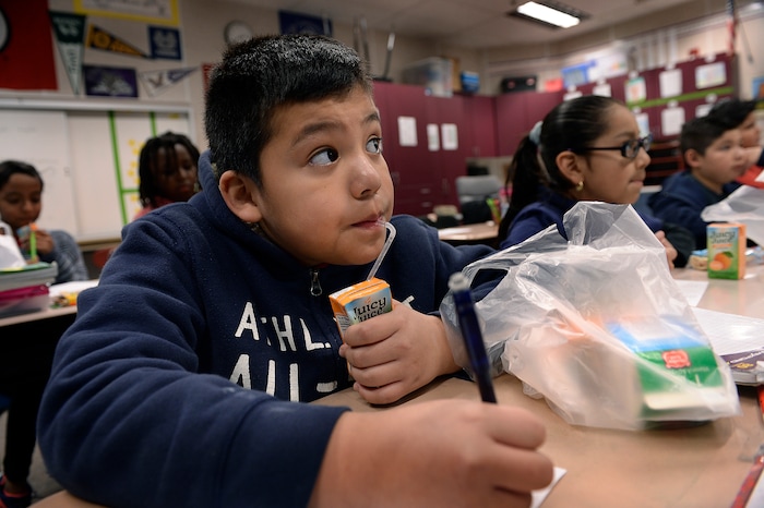 Scott Sommerdorf | The Salt Lake TribuneDylan Pratz sips on his "Juicy Juice" while studying in Mr. Mills' 4th grade class at Backman Elementary SchoolÕs Breakfast in the Classroom program, Wednesday, March 21, 2018.