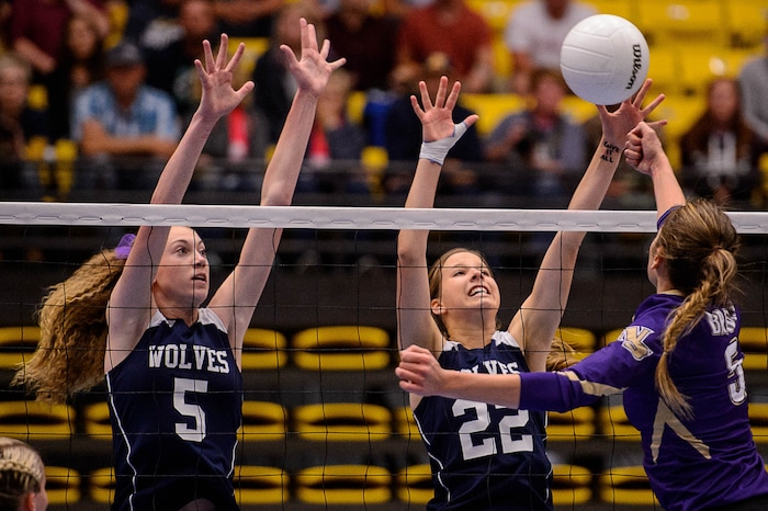 (Trent Nelson | The Salt Lake Tribune) Enterprise's Ronnie Robinson, Enterprise's Jessica Holt leap to block a shot as Enterprise faces North Summit in the 2A State Volleyball Championship game in Orem, Saturday October 28, 2017.
