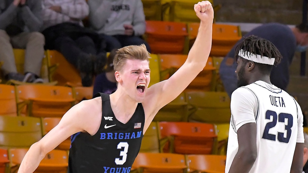 BYU forward Matt Haarms (3) celebrates next to Utah State center Neemias Queta (23) after BYU's win in an NCAA college basketball game Saturday, Dec. 5, 2020, in Logan, Utah. (Eli Lucero/The Herald Journal via AP, Pool)