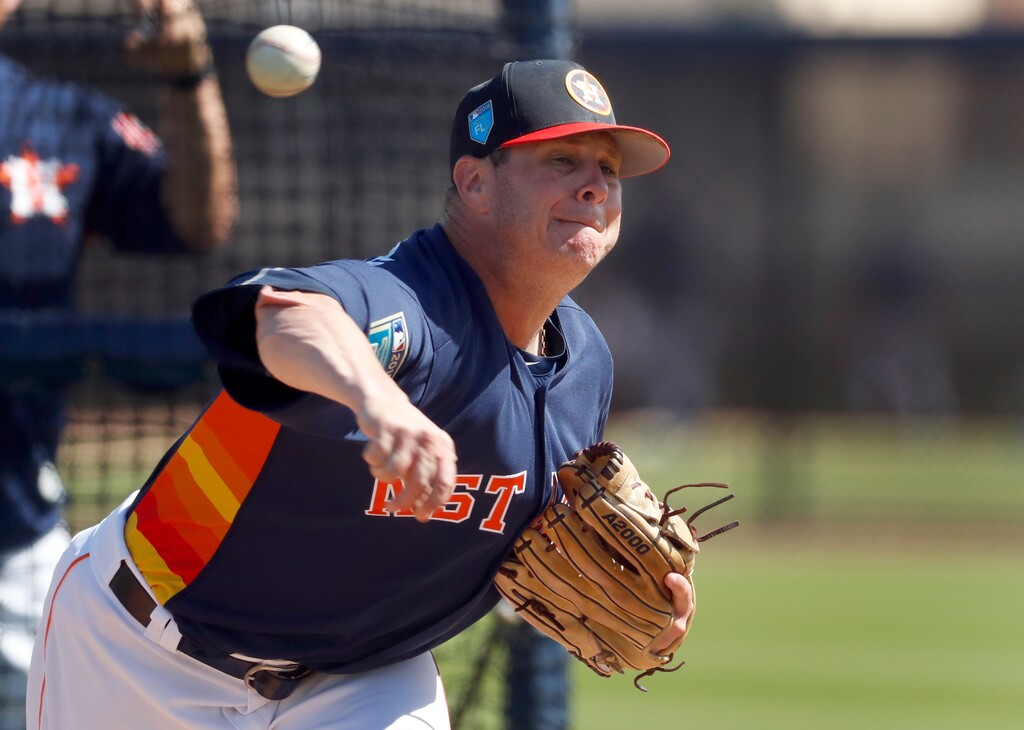Houston Astros pitcher Brad Peacock throws live batting practice during spring training baseball practice Monday, Feb. 19, 2018, in West Palm Beach, Fla. (AP Photo/Jeff Roberson)