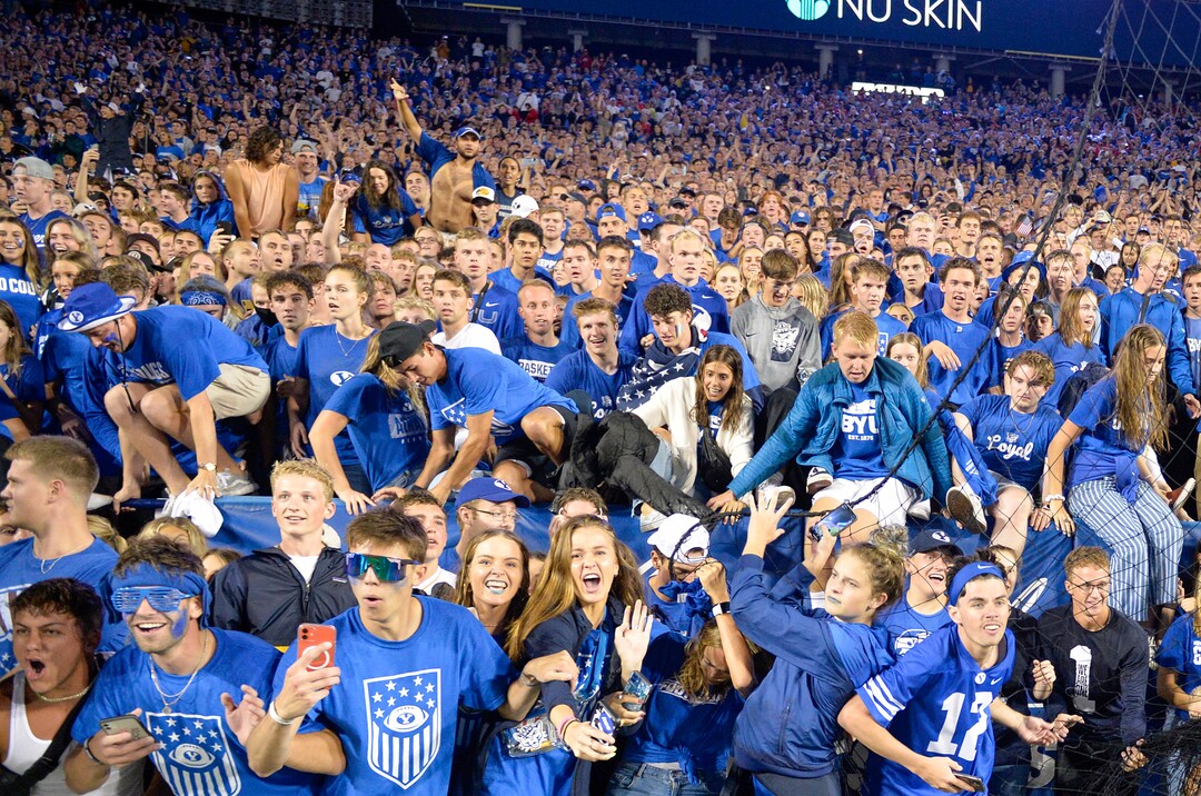 (Chris Samuels | The Salt Lake Tribune) Fans storm the field as the Brigham Young Cougars defeat the Utah Utes 26-17 in football, Saturday, Sept. 11, 2021 in Provo.