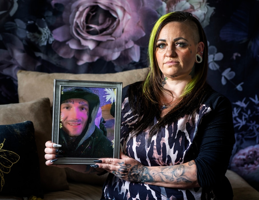 (Rick Egan | The Salt Lake Tribune) Cassie Beggs holds a photo of her fiancé, who is incarcerated at the Beaver County Jail, on Thursday, June 15, 2023. Beggs, 36, is a nail tech supporting four children. To stay in touch and save money, she and her fiancé have cut back on phone calls, she said.