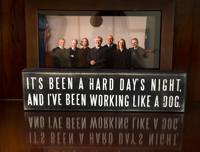 Leah Hogsten  |  The Salt Lake TribuneUtah Court of Appeals judge Frederic Voros' desk displays a photo of the he and other members of the Utah Appellate Court along with a quote from the Beatles' song "Hard Days Night." Voros is retiring August 1, 2017 from the bench. 