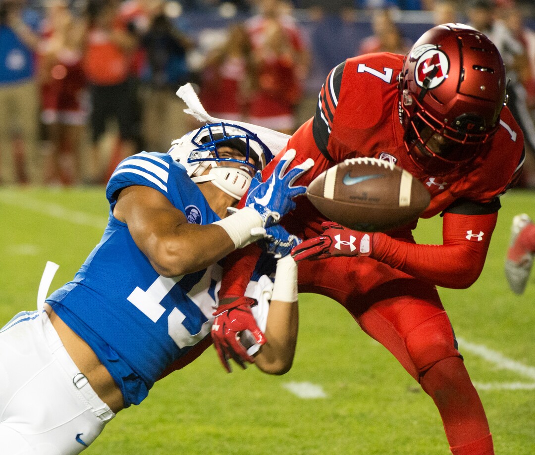 (Rick Egan  |  The Salt Lake Tribune) Utah Utes defensive back Jaylon Johnson (7) breaks up a pass intended for Brigham Young Cougars wide receiver Aleva Hifo (15), in football action BYU vs Utah, at Lavell Edwards Stadium in Provo, Saturday, September 9, 2017.