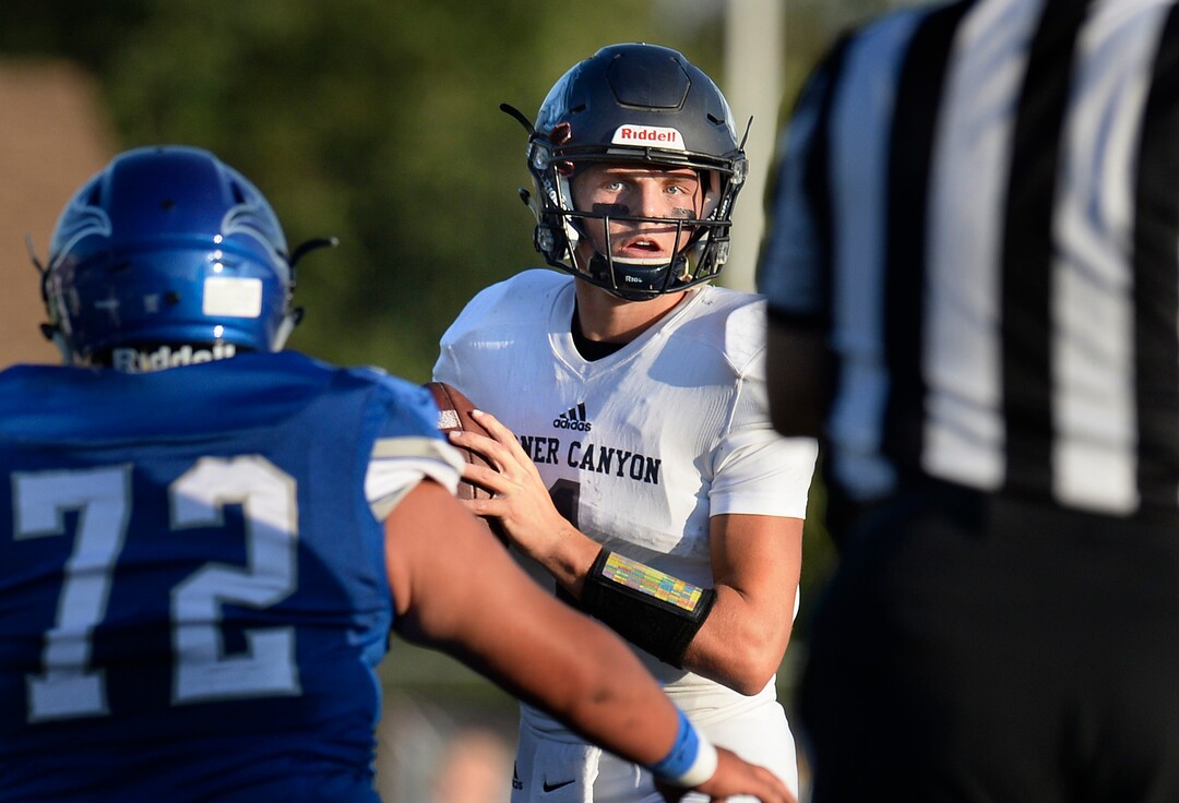 (Scott Sommerdorf   |  The Salt Lake Tribune)   Corner Canyon QB Zach Wilson looks for a receiver during first half play. Corner Canyon led Pleasant Grove 14-3 at the half, Friday, August 18, 2017.  led Pleasant Grove 14-3 at the half, Friday, August 18, 2017. 