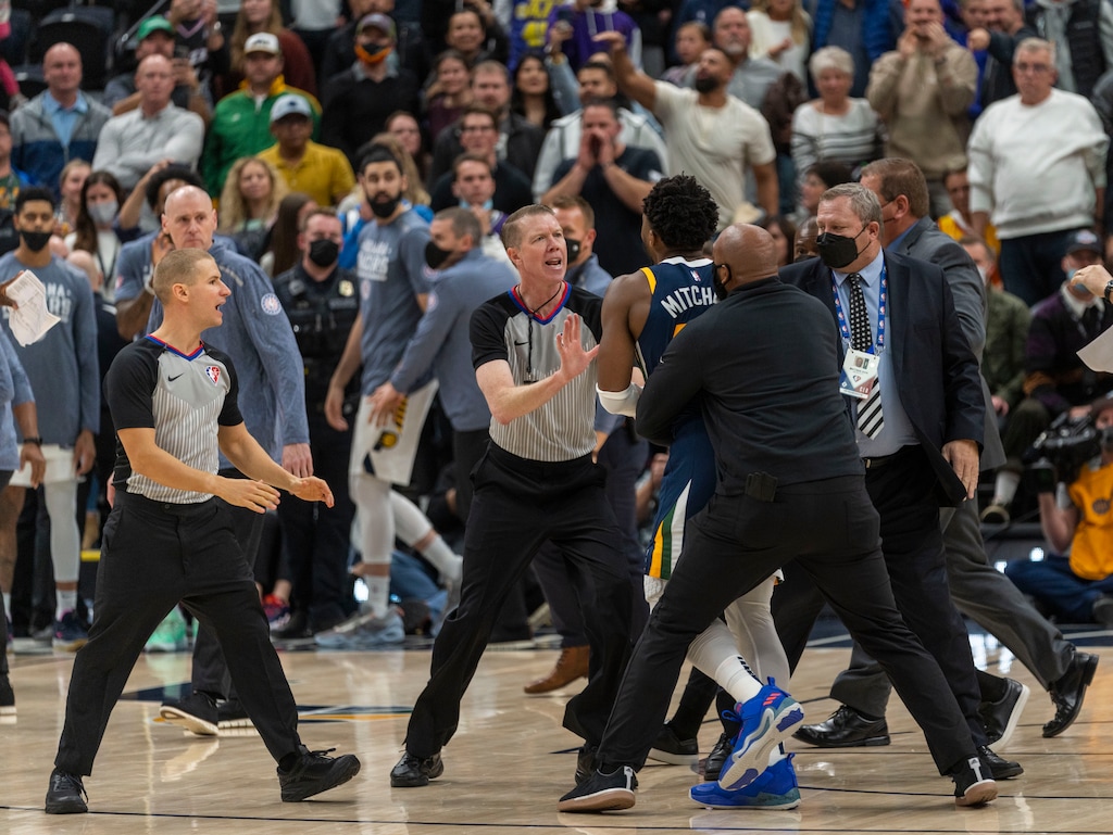 (Rick Egan | The Salt Lake Tribune) Referee Ed Malloy tries to stop Utah Jazz guard Donovan Mitchell (45) from getting to the Indiana Pacers bench after a scuffle between Indiana center Miles Turner and  Jazz center Rudy Gobert, resulting in 4 ejections, in the 4th quarter, in NBA action between Utah Jazz and Indiana Pacers at Vivint Arena, on Thursday, Nov. 11, 2021.