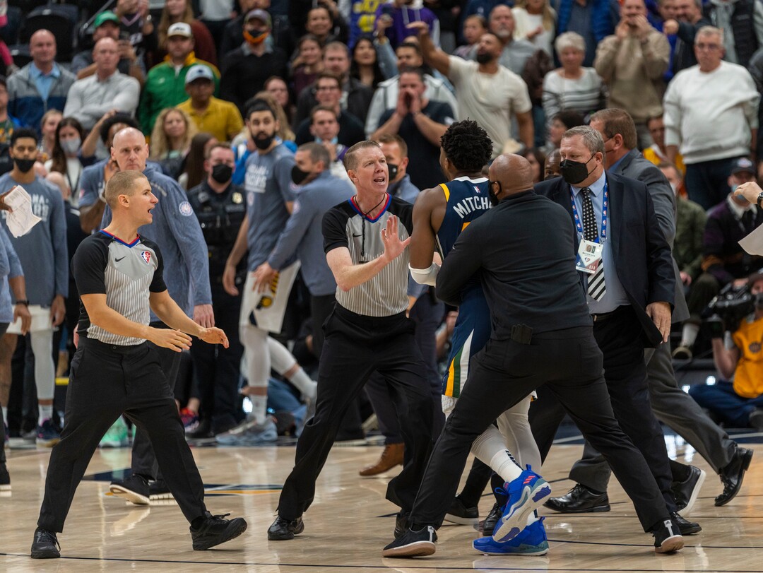 (Rick Egan | The Salt Lake Tribune) Referee Ed Malloy tries to stop Utah Jazz guard Donovan Mitchell (45) from getting to the Indiana Pacers bench after a scuffle between Indiana center Miles Turner and  Jazz center Rudy Gobert, resulting in 4 ejections, in the 4th quarter, in NBA action between Utah Jazz and Indiana Pacers at Vivint Arena, on Thursday, Nov. 11, 2021.