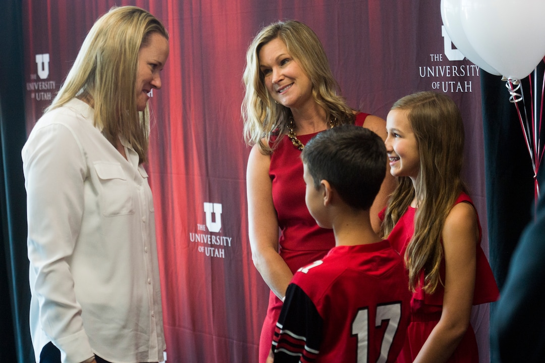 (Rick Egan  |  The Salt Lake Tribune)   wife Carolyn Harlan, wife of the new University of Utah Athletic Director Mark Harlan, visits with Utah women’s basketball coach, Lynn Robertsalong with her children, Savanah 13, and Austin, 10, after a news conference at the Rice-Eccles Stadium,  Monday, June 4, 2018.