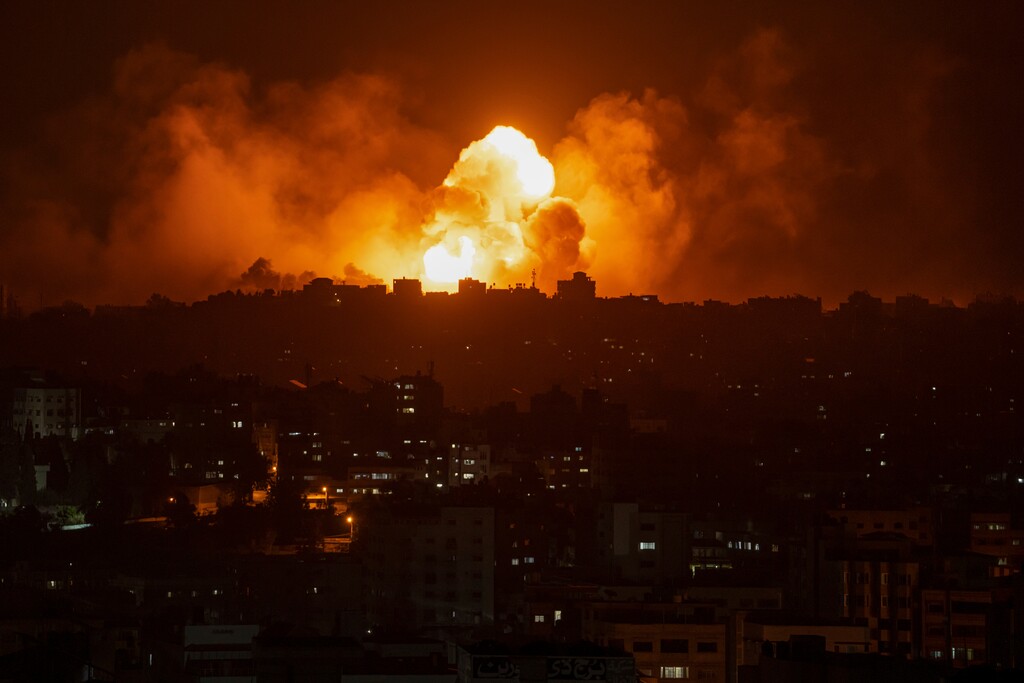 (Fatima Shbair | AP) Fire and smoke rise following an Israeli airstrike, in Gaza City, Sunday, Oct. 8, 2023. The militant Hamas rulers of the Gaza Strip carried out an unprecedented, multi-front attack on Israel at daybreak Saturday, firing thousands of rockets as dozens of Hamas fighters infiltrated the heavily fortified border in several locations, killing hundreds and taking captives. Palestinian health officials reported scores of deaths from Israeli airstrikes in Gaza.