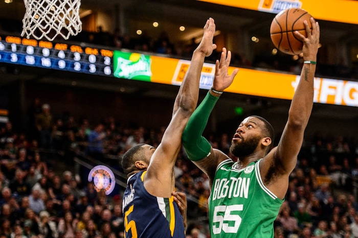 (Trent Nelson | The Salt Lake Tribune)  
Utah Jazz vs. Boston Celtics, NBA basketball in Salt Lake City, Wednesday March 28, 2018. Boston Celtics center Greg Monroe (55) shoots over Utah Jazz forward Derrick Favors (15).