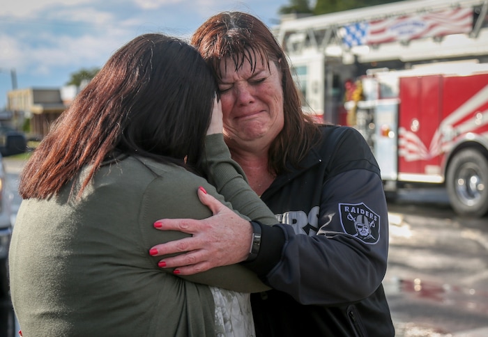(Benjamin Zack | Standard-Examiner via AP) Gaelynn Sewell, right, holds her daughter, Morgan Sewell after a tornado hit their home in Washington Terrace, Utah, on Thursday, Sept. 22, 2016. Gaelynn was at home at the time. Her legs were cut with glass and she was worried about possible broken ribs.