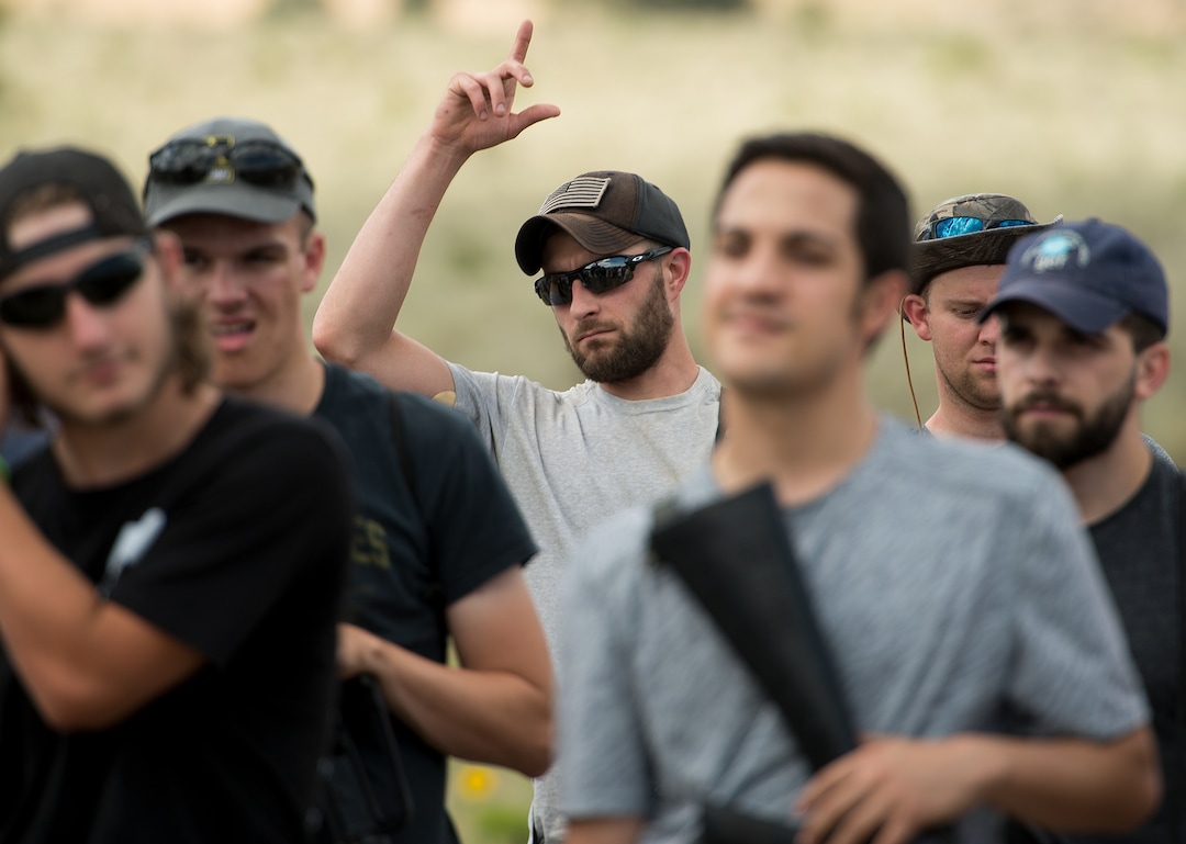 (Leah Hogsten  |  The Salt Lake Tribune) Cody Fitzgerald, 30, from Aurora, CO served as an E-4 in the Air Force and admitted that he has been thinking of joining the Special Forces team. Fitzgerald and other attendees learn about a AH-64 Apache Attack helicopter from the 211th Aviation Group during the Utah National Guard Special Forces Survival Training Experience, August 10-12 at Camp Williams.