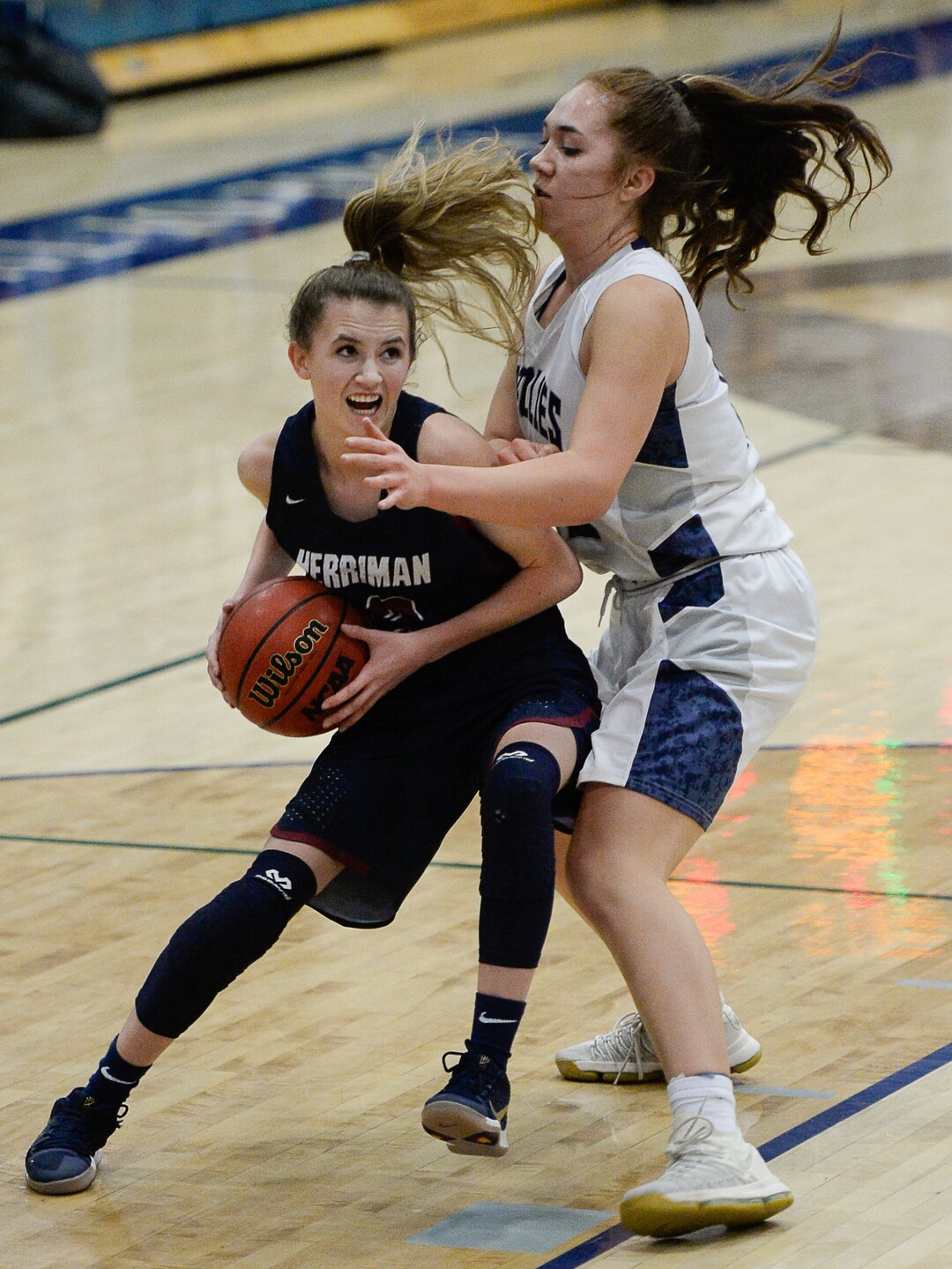 (Francisco Kjolseth  |  The Salt Lake Tribune)  Herriman's Millee Enger tries to push past  Taela Laufiso of Copper Hills in game action in West Jordan on Thursday, Jan. 25, 2018.