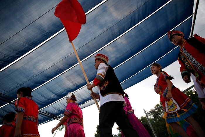 (Daniel Carde | for The Salt Lake Tribune) Performers from China walk as they are introduced at the World Folkfest at the Springville Arts Park, Springville, Thursday, Aug. 1, 2018.