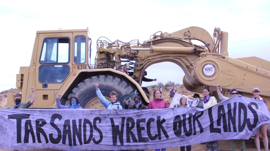 Courtesy | Steve Liptay/Peaceful UprisingClimate Justice activists halt mining operations and road construction at the first US tar sands stripmine, located in Eastern Utah.