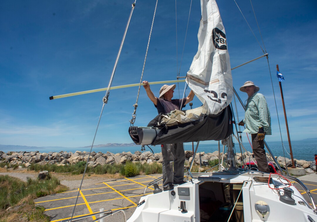 (Rick Egan  |  The Salt Lake Tribune)     Rick Hoffman and Greg Wilson work on a boat at the Great Salt Lake Marina,Tuesday, June 11, 2019.