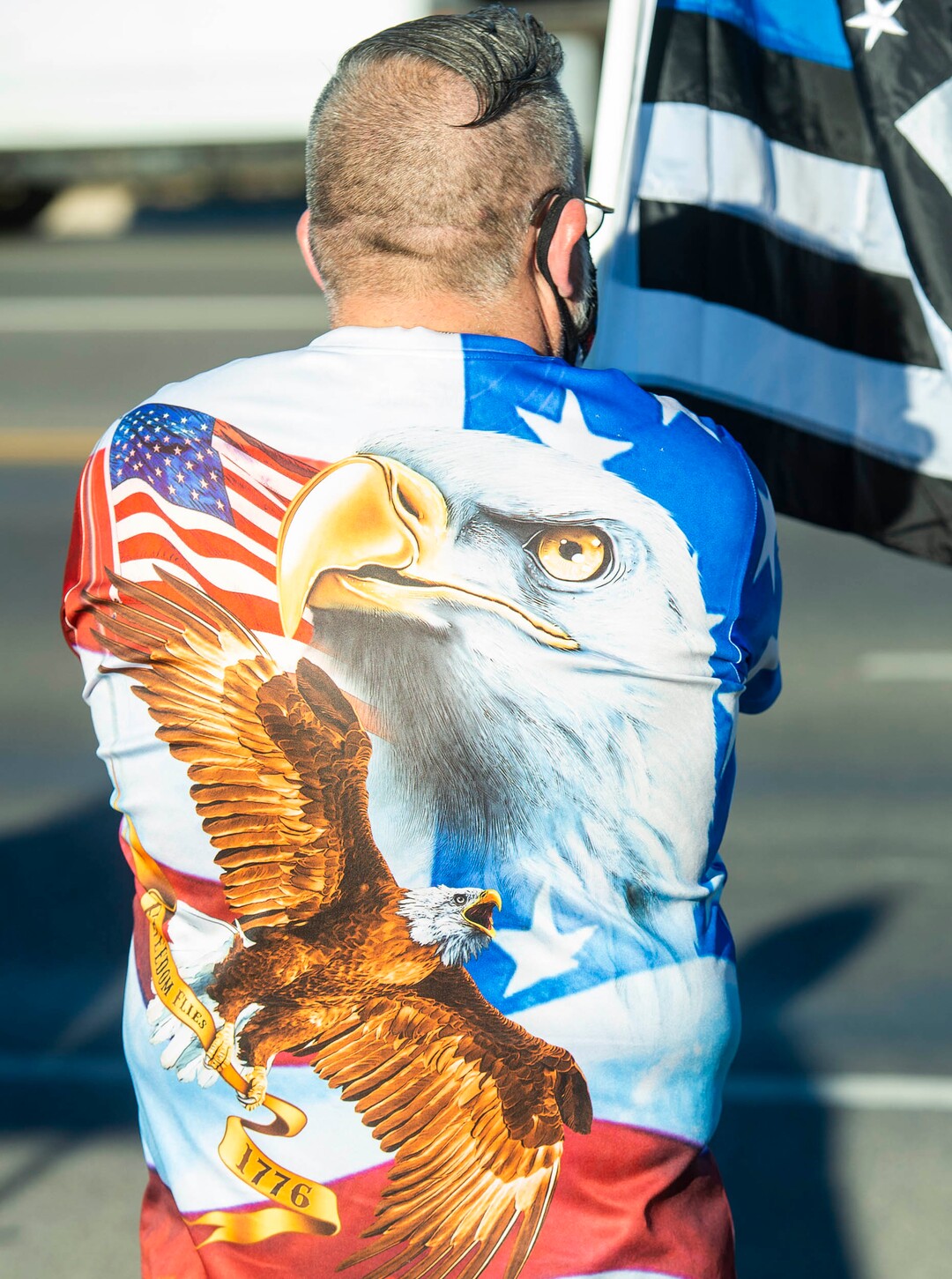 (Rick Egan  |  The Salt Lake Tribune)     Police supporters upset by a Pat Bagley cartoon, wear flags and wave flags as they protest The Salt Lake Tribune in West Valley City, on Thursday, Sept. 3, 2020.