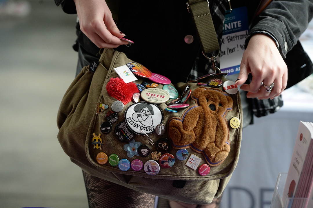 (Francisco Kjolseth  |  The Salt Lake Tribune)  A young attendee adds another button to their bag during EncircleÕs 2nd annual LGBTQ+ youth summit at Adobe headquarters in Lehi on Saturday, Dec. 1, 2018.
