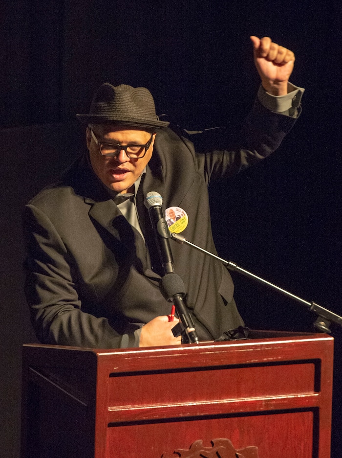 (Rick Egan  |  The Salt Lake Tribune)      MC Billy Palmer leads the crowd in a chant of "Sí se puede" at the memorial service for Robert "Archie" Archuleta, at the Rose Wagner Theatre, Saturday, March 2, 2019.


