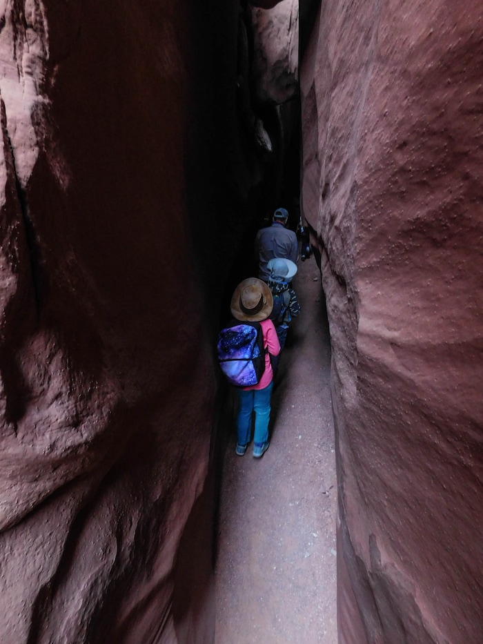 (Erin Alberty|The Salt Lake Tribune) Hikers pass through a narrow part of Leprechaun Canyon on April 29, 2017.