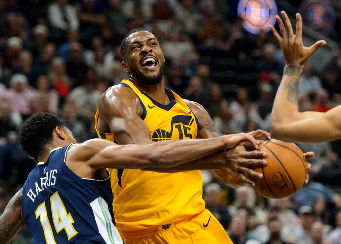 (Steve Griffin  |  The Salt Lake Tribune) Utah Jazz forward Derrick Favors (15) drives into the lane as Denver Nuggets guard Gary Harris (14) tries to strip the ball during the Utah Jazz versus Denver Nuggets NBA basketball game at Vivint Smart Home Arena  in Salt Lake City Tuesday November 28, 2017.