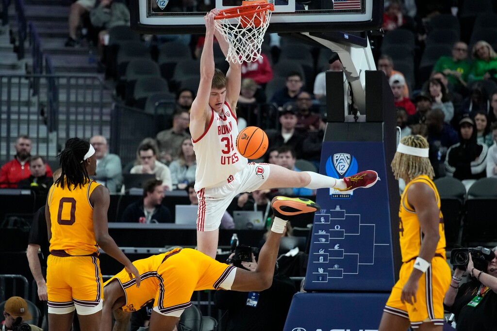 (John Locher | AP) Utah center Lawson Lovering (34) dunks over Arizona State center Shawn Phillips Jr. during the first half of an NCAA college basketball game in the first round of the Pac-12 tournament Wednesday, March 13, 2024, in Las Vegas.