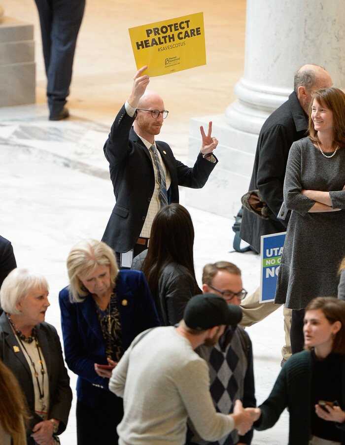 (Francisco Kjolseth  |  The Salt Lake Tribune)  Newly elected Sen. Derek Kitchen, D-Salt Lake, shows his support for the demonstrators gathered in the Capitol rotunda on Monday, Jan, 28, 2019, on the first day of the Legislative session to rally in support of protecting Proposition 3, the Medicaid Expansion law recently passed by voters.