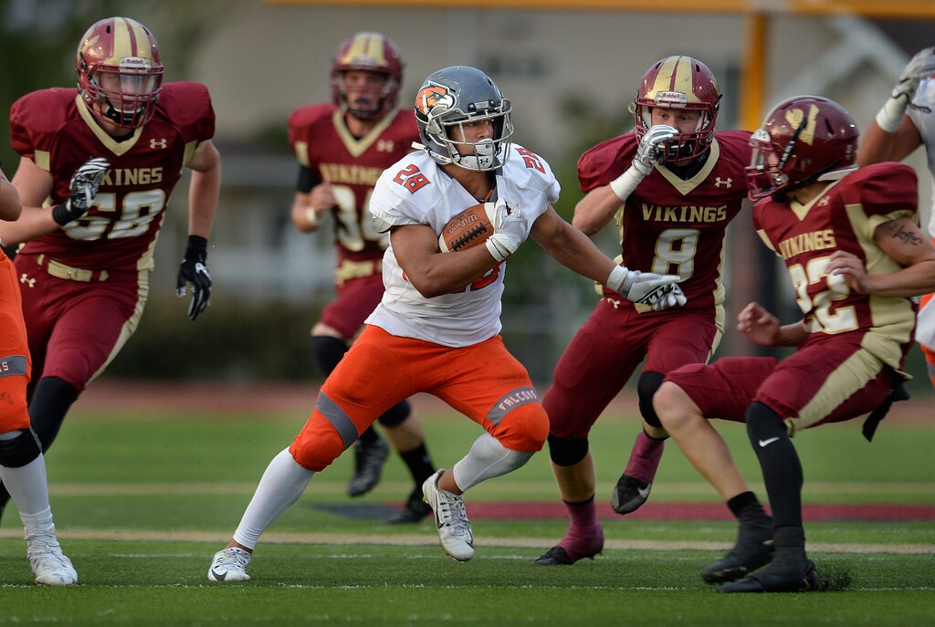 (Scott Sommerdorf   |  The Salt Lake Tribune)   
Skyridge running back Tanner Sperry runs through a hole during Friday's first half.