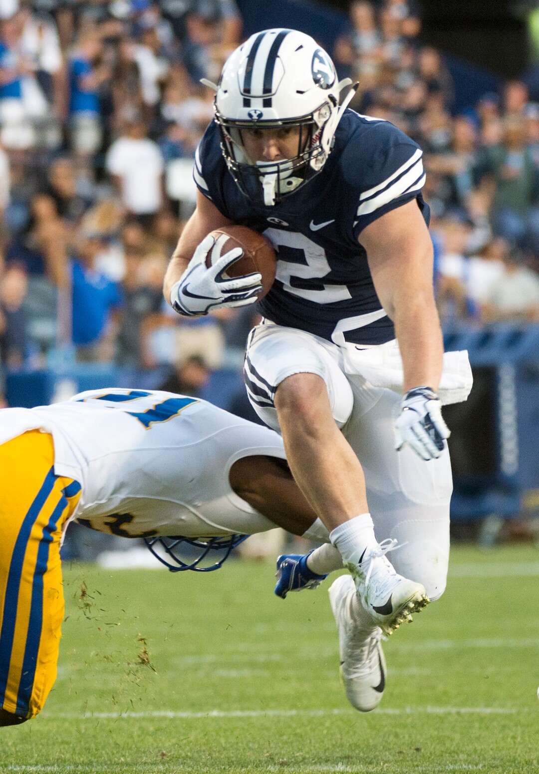 (Rick Egan  |  The Salt Lake Tribune)    Brigham Young Cougars running back Matt Hadley (2) runs the ball as McNeese State Cowboys defensive back Andre Sam (21) defends, in football action Brigham Young Cougars vs McNeese State Cowboys at Lavell Edwards Stadium, Saturday, Sept. 22, 2018.
