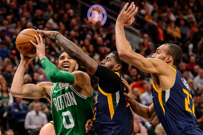 (Trent Nelson | The Salt Lake Tribune)  
Utah Jazz vs. Boston Celtics, NBA basketball in Salt Lake City, Wednesday March 28, 2018. Boston Celtics forward Jayson Tatum (0) defended by Utah Jazz forward Royce O'Neale (23) and Utah Jazz center Rudy Gobert (27).