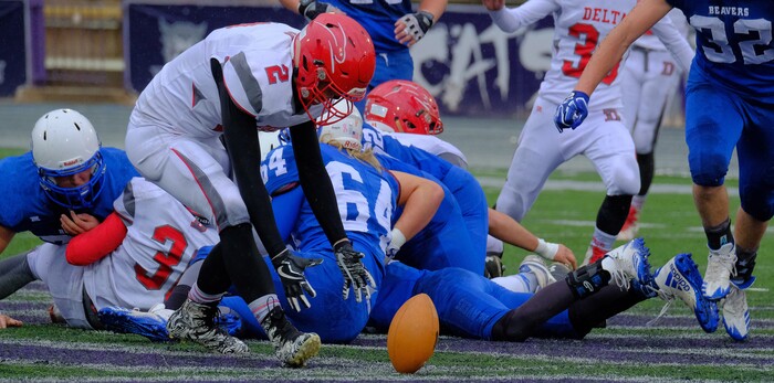 (Leah Hogsten  |  The Salt Lake Tribune) Delta's Trevor Burton picks up Beaver's fumble. Beaver High School boys' football team defeated Delta High School 35-16 during their class 2A state semifinal football game Saturday, November 4, 2017 at Weber State University's Stewart Stadium.