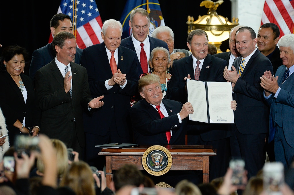 (Francisco Kjolseth  |  The Salt Lake Tribune)  U.S. President Donald Trump is surrounded by Utah representatives at the Utah Capitol on Monday, Dec. 4, 2017, as he signs two presidential proclamations to shrink Bears Ears and Grand Staircase-Escalante national monuments.