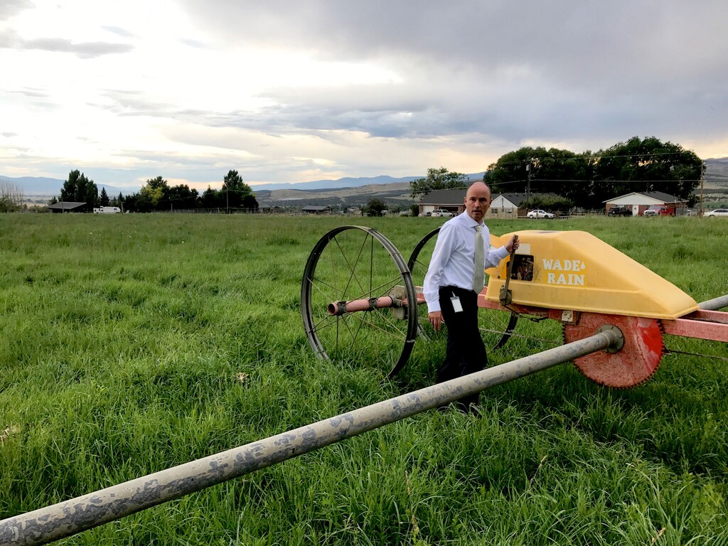 (photo courtesy Spencer Cox)  Lt. Governor Spencer Cox works on his farm near Fairview.