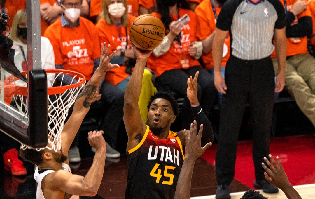 (Rick Egan | The Salt Lake Tribune) Utah Jazz guard Donovan Mitchell (45) shoots, as  Memphis Grizzlies forward Kyle Anderson (1) and Memphis Grizzlies forward Jaren Jackson Jr. (13) defend, in NBA Playoff game 2, between the Utah Jazz and the Memphis Grizzlies at Vivint Arena, on Wednesday, May 26, 2021.
