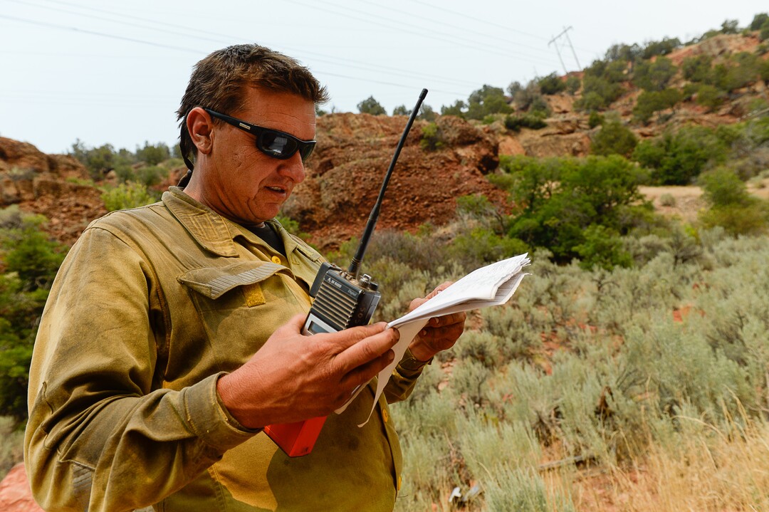 (Francisco Kjolseth  |  The Salt Lake Tribune)  Kenney Bochniak, Assistant Super Independent for Snake River Hotshots coordinates water drops while working the Coal Hollow Fire along Highway 6 in Utah County on Saturday, Aug. 11, 2018.