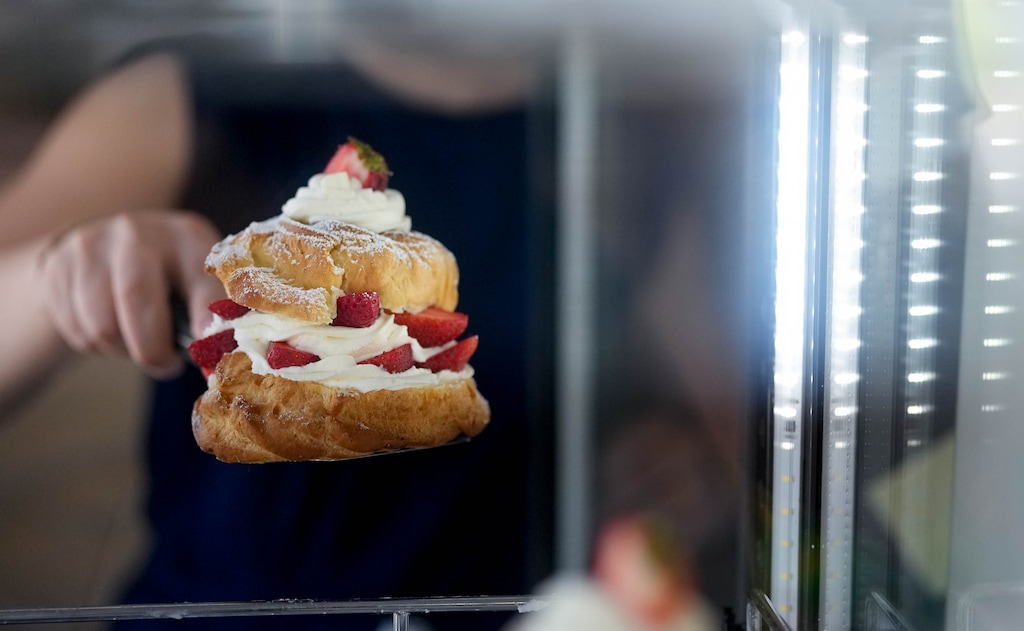 (Francisco Kjolseth | The Salt Lake Tribune) Azzurra Cuchel serves a strawberry zeppola at Sapori Italian Bakery & Cafe in Salt Lake City on Wednesday, July 8, 2026. 