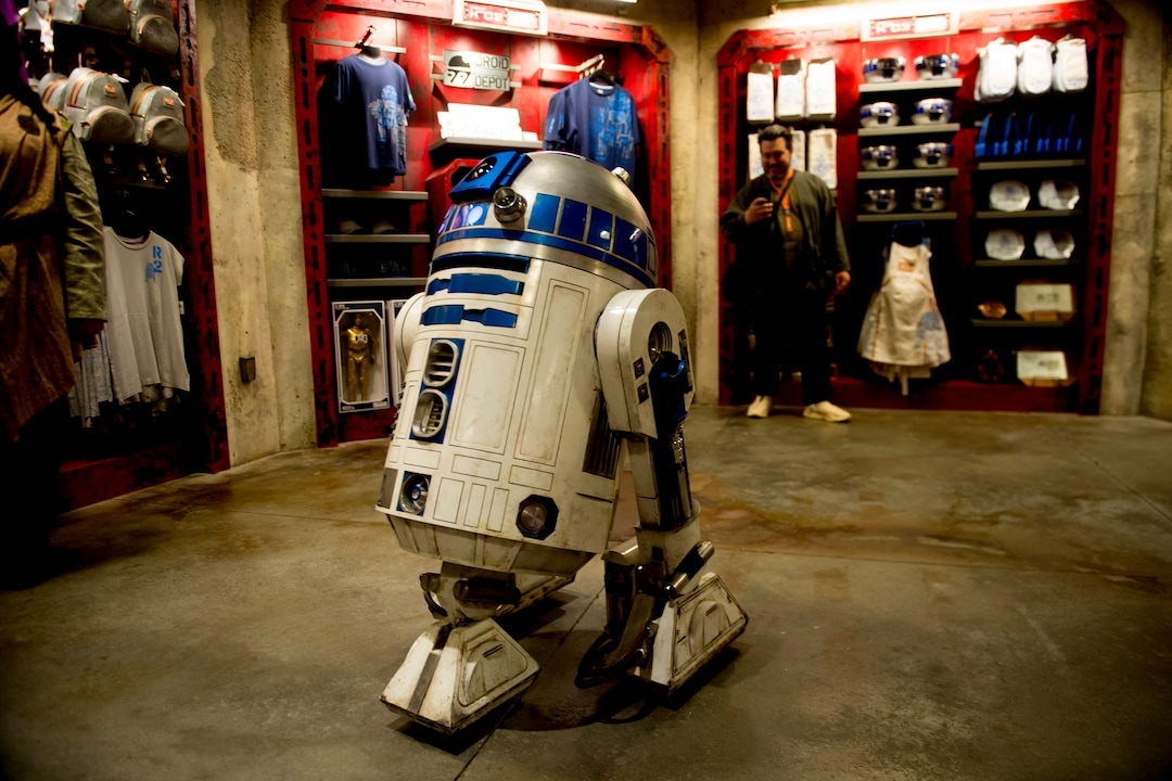 (Jeremy Harmon  |  The Salt Lake Tribune) R2-D2 holds court in the gift shop at the Droid Depot at Star Wars: Galaxy's Edge in Anaheim, Ca. on Wednesday, May 29, 2019.