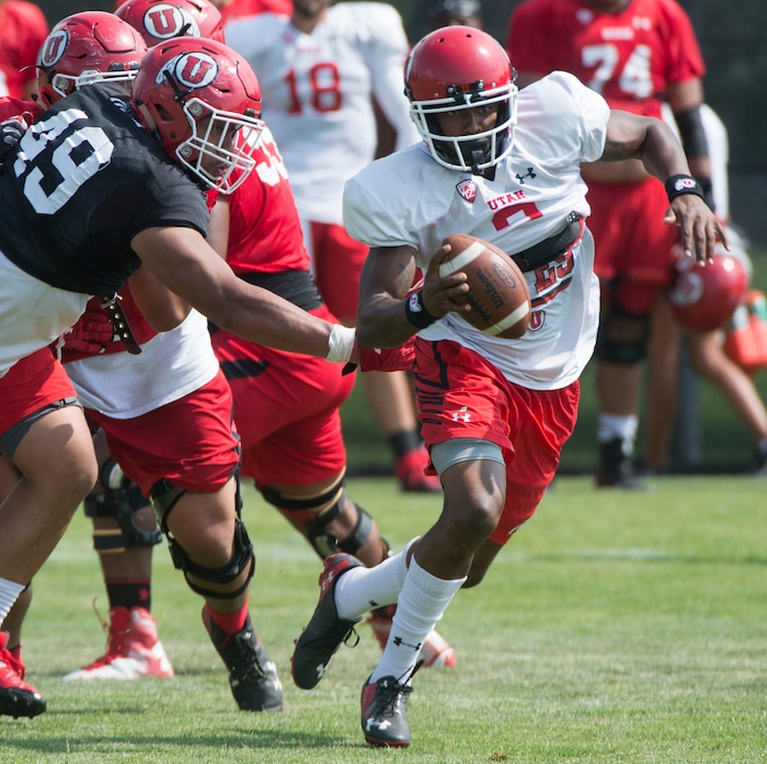 (Rick Egan  |  The Salt Lake Tribune)

Utah quarterback Troy Williams scrambles with the ball during practice, Monday, August 7, 2017.


