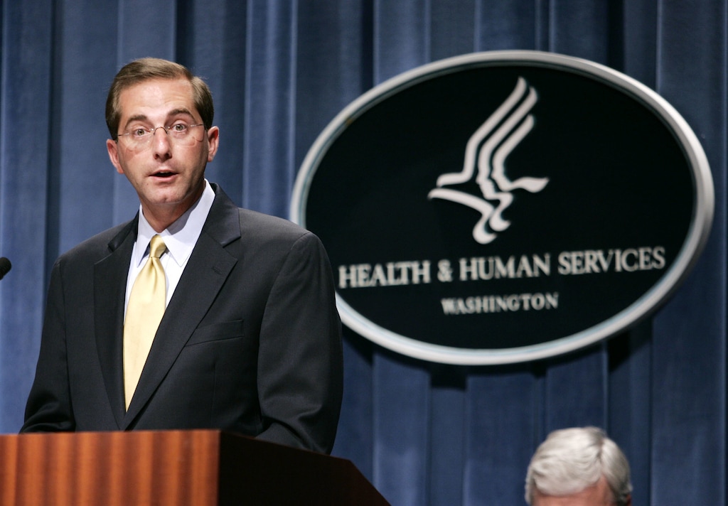 FILE - In this June 8, 2006 file photo, then Deputy Health and Human Services Secretary Alex Azar meets reporters at the HHS Department in Washington.  Newly disclosed financial records show that Azar, President Donald Trump’s nominee to become secretary for the Health and Human Services Department, reaped big earnings during his tenure as a top pharmaceutical executive. (AP Photo/Evan Vucci)