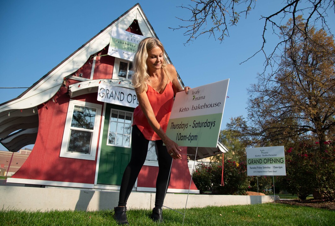 (Francisco Kjolseth  |  The Salt Lake Tribune) Melanie Edwards puts up signage on the iconic Sugarhouse ‘Santa Shack" as it is transformed into a new gluten-free bakery called The Keto Bakehouse. Edwards plans to open on Thursday, Oct. 8, selling gluten-free, low carb, no-sugar cookies, cakes, brownies, cupcakes, chocolates, trail mixes, and energy bars.