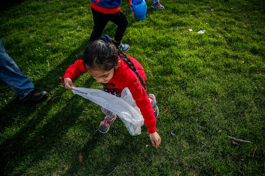 (Nicole Boliaux  |  For The Tribune)  Children and their families run to grab Easter eggs during the annual Easter egg hunt put on by A Kid's Place Dentistry in Liberty Park in Salt Lake City on Saturday, March 31, 2018.