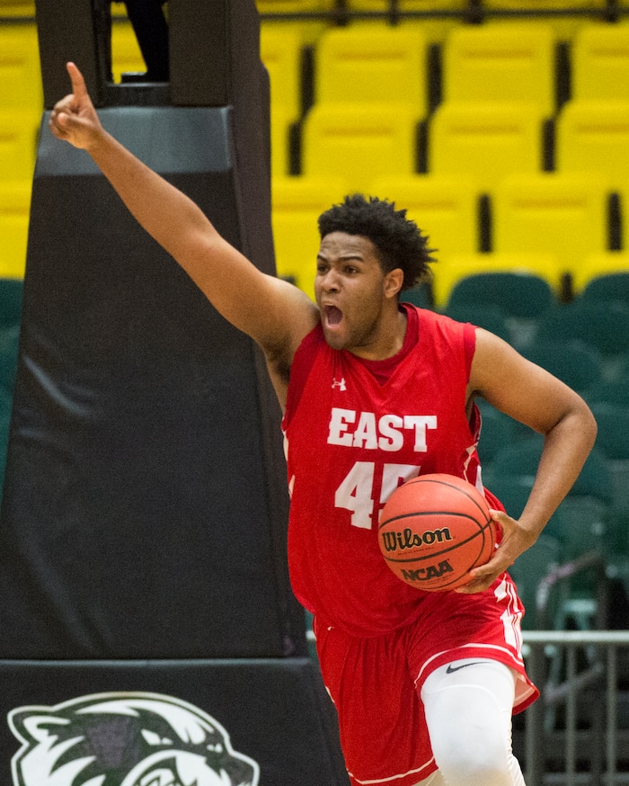 (Rick Egan  |  The Salt Lake Tribune)   East Leopards Mikey Frazier (45) celebrates East High's 54-53 win over the Jordan Beatdiggers, in 5A basketball playoff action at the UCCU Center in Orem, Monday, Feb. 26, 2018.