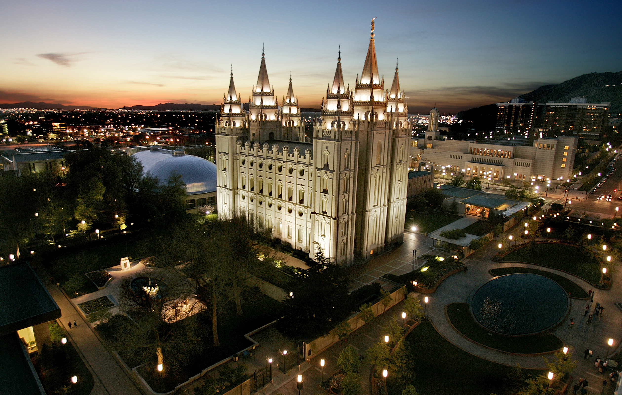 FILE - In this April 27, 2006, file photo, the sun sets behind the Mormon Temple, the centerpiece of Temple Square, in Salt Lake City. Fewer than half the residents of Salt Lake County belong to the Mormon church, according to new figures that illustrate how Utah's largest county is becoming more religiously diverse. Mormons account for 49 percent of the 1.1 million residents in Salt Lake County — the lowest percentage since at least the 1930s, The Salt Lake Tribune reported Dec. 9, 2018. (AP Photo/Douglas C. Pizac, File)