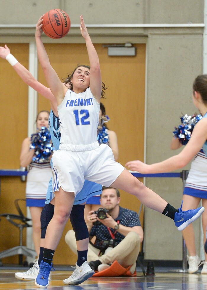 (Leah Hogsten  |  The Salt Lake Tribune) Fremont's Abby Broadbent (12) pulls in the rebound.  Fremont faces Westlake in their semifinal game of the 6A High School Girls' Basketball Tournament at SLCC in Taylorsville, Friday, Feb. 23, 2018. 