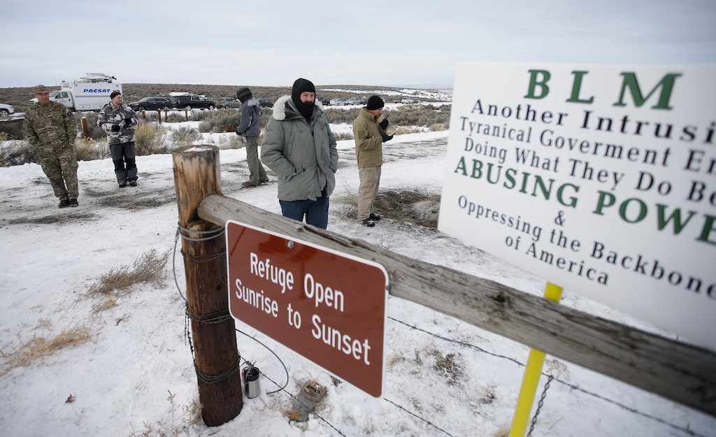 (Rick Bowmer | AP file photo) In this Monday, Jan. 4, 2016, file photo, members of the group occupying the Malheur National Wildlife Refuge headquarters stand guard near Burns, Ore. A jury on Thursday, Oct. 27, 2016, exonerated brothers Ammon and Ryan Bundy and five others of conspiring to impede federal workers from their jobs at the refuge.
