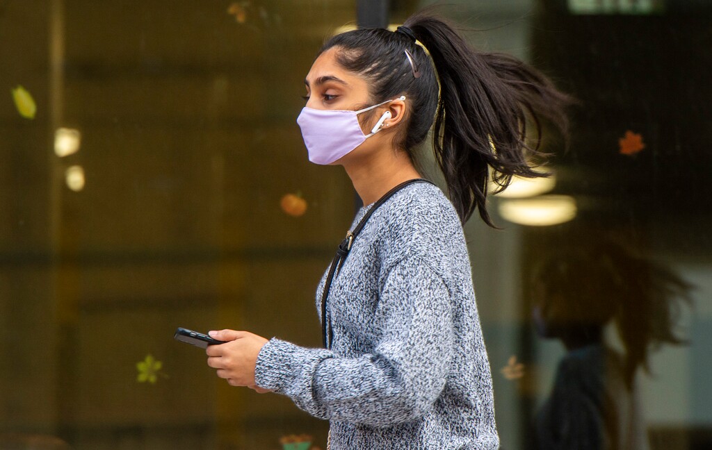 (Rick Egan | The Salt Lake Tribune) A pedestrian wears a mask on Main Street, in downtown Salt Lake City, Wednesday, Nov. 18, 2020.