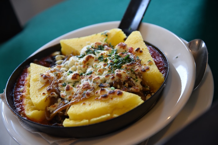 (Francisco Kjolseth  |  The Salt Lake Tribune)  Polenta Con Fungi, wild mushrooms sauted with roasted garlic, served  on polenta with tomato sauce melted gorgonzola and caramelized onions at Caffe Molise which recently opened in its new location inside the old (but completely updated) Eagle Building on the southwest corner of 400 South and West Temple.