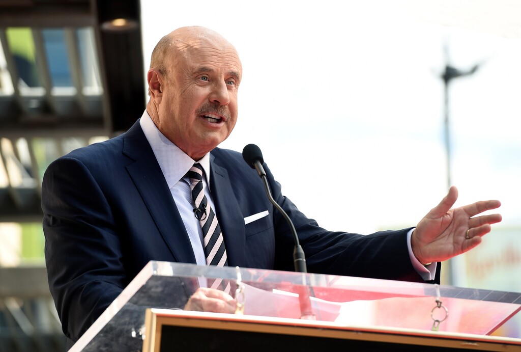 (Chris Pizzello | AP file photo)
This Feb. 21 photo shows talk show host Dr. Phil McGraw speaking during a ceremony awarding him with a star on the Hollywood Walk of Fame in Los Angeles. Two television doctors — Dr. Oz and Dr. Phil — find themselves trying to explain comments made on Fox News Channel about the coronavirus. Dr. Mehmet Oz says he misspoke during an appearance where he said reopening schools was a “very appetizing opportunity” despite the coronavirus epidemic. Meanwhile, McGraw says he used bad examples while appearing on Laura Ingraham's show when he compared coronavirus deaths to deaths caused by cigarettes, auto accidents and swimming pools.